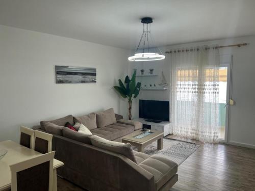 a living room with a couch and a table at Sea view in Durrës