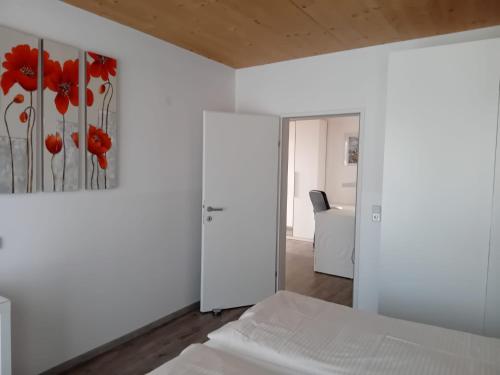 a bedroom with a bed and a painting on the wall at Landhaus Almidyll in Seefeld in Tirol