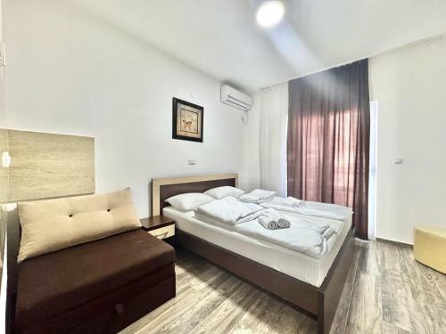 Ένα ή περισσότερα κρεβάτια σε δωμάτιο στο Beachfront Hotel Palma - Jaz