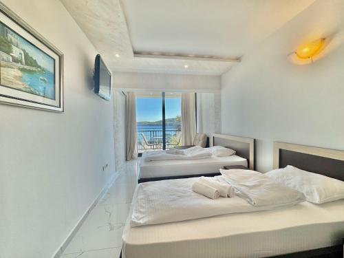 Ένα ή περισσότερα κρεβάτια σε δωμάτιο στο Beachfront Hotel Palma - Jaz