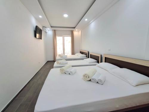 Ένα ή περισσότερα κρεβάτια σε δωμάτιο στο Beachfront Hotel Palma - Jaz