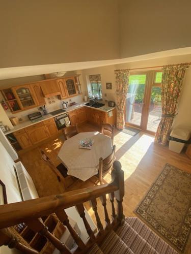 an overhead view of a kitchen and a table in a kitchen at Beech Farm cottages in Tetney