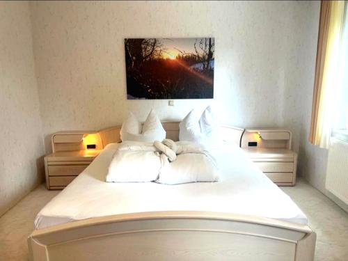 Ένα ή περισσότερα κρεβάτια σε δωμάτιο στο Ankommen, Aufatmen, Wohlfühlen - Urlaub und Workaktion im Oberharz