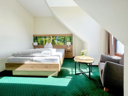Postel nebo postele na pokoji v ubytování Hotel Schwartze