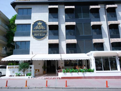 a hotel building with a restaurant in front of it at bahçelievler hotels in Ankara