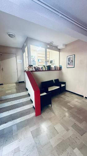 a room with a bench and stairs in a building at Résidence Thermale - 3 étoiles - Cap sur le Canigou in Vernet-les-Bains