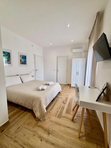 Ένα ή περισσότερα κρεβάτια σε δωμάτιο στο Guest House Levante