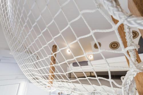 a close up of a net on a ceiling at Ocean view villa in Mikonos