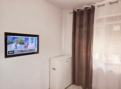 Un televizor și/sau centru de divertisment la Grace's Centre Apartment