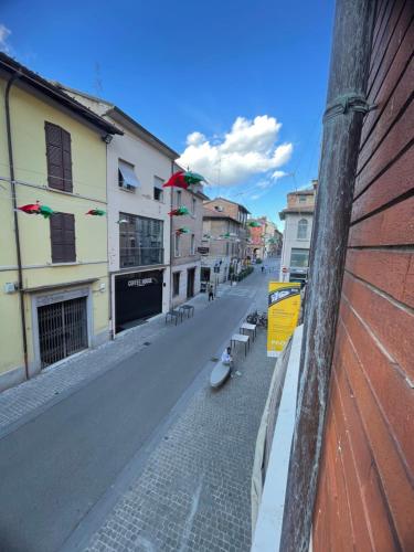 a view of a street with buildings on the side at Muzien B&B in Imola
