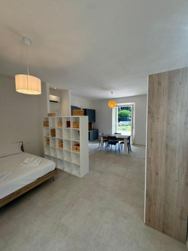 a bedroom with a bed and a dining room at Locanda Francini in Badia A Passignano