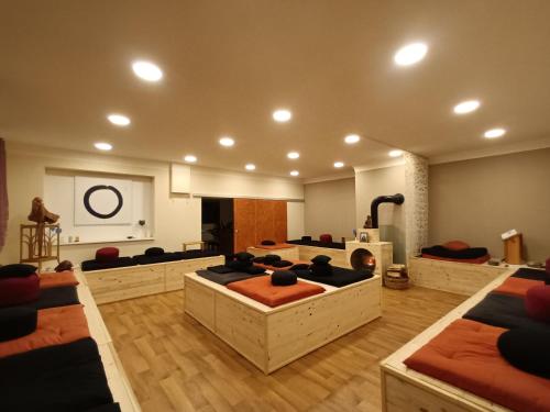 a large room with couches and a room with a fireplace at Lee ZEN in Leezen