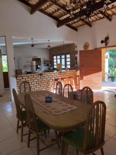 a dining room table and chairs in a kitchen at Casa em Rio de Contas in Rio de Contas