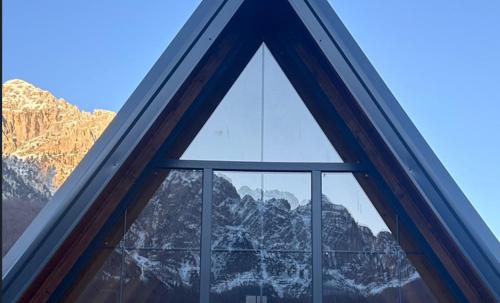 a window with a view of a mountain at SeSam Villas in Theth