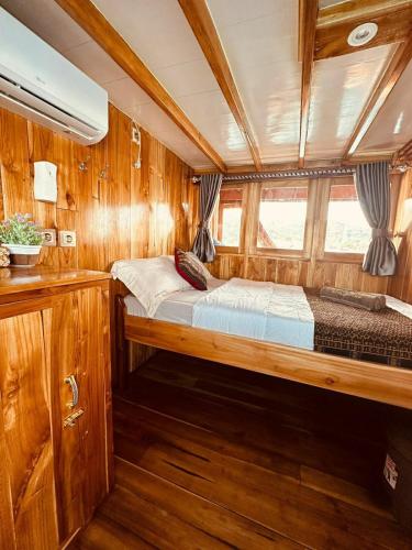a room with two beds in a boat at Komodo Island Tour 3 Days with Best Komodo Tour in Pulau Kukusan