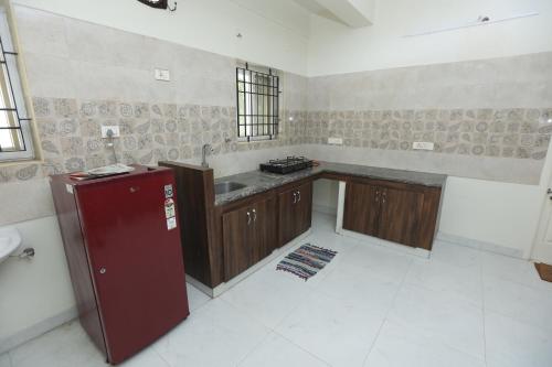 a kitchen with a sink and a counter top at Happy homes services apartments -Near-Olympia Technology Park-SKCL Central Square in Chennai