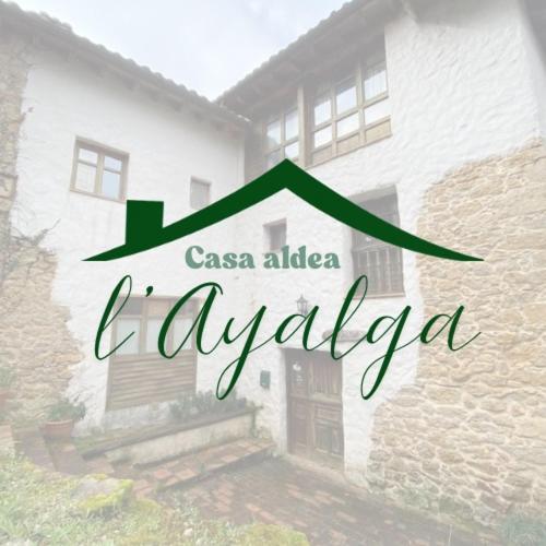 a sign that says casa aleza evolia on a building at Casa Aldea l'Ayalga in Beloncio