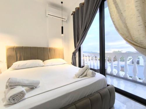 Postel nebo postele na pokoji v ubytování Sunset Hotel