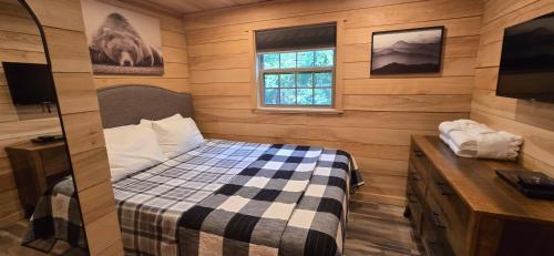 a small bedroom with a bed and a window at Recreational Therapy- Private 2 Bedroom with Hot Tub and Firepit in Oakland
