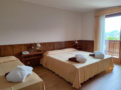 Giường trong phòng chung tại Albergo Villa Cristina