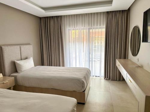 Un ou plusieurs lits dans un hébergement de l'établissement Petra Palace Hotel