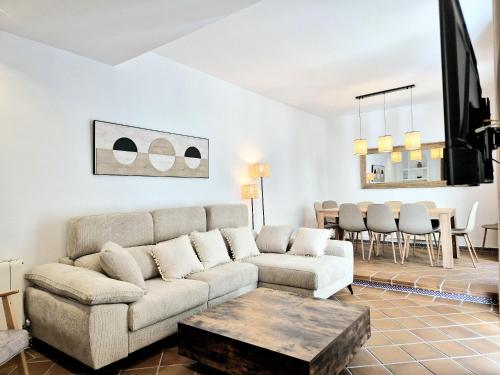 a living room with a couch and a table at BHost - Palace in Córdoba