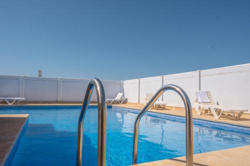 a swimming pool with metal railings in a hotel at Appart Hotel Star in Tangier