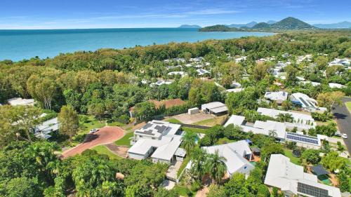 an aerial view of a house with trees and the water at SeaTurtle in Clifton Beach