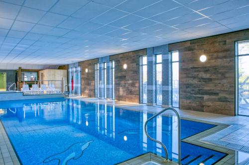 a large swimming pool with a dolphin painted on it at Newlands Holidays in Bridport