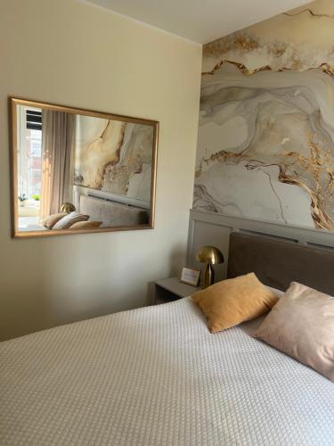 Ένα ή περισσότερα κρεβάτια σε δωμάτιο στο Apartament w sercu miasta