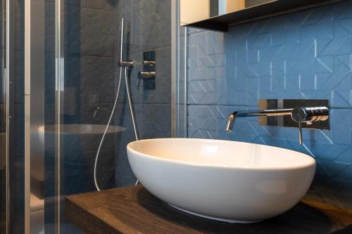 a white bowl sink on a counter in a bathroom at Hotel Baia di Talamone in Talamone
