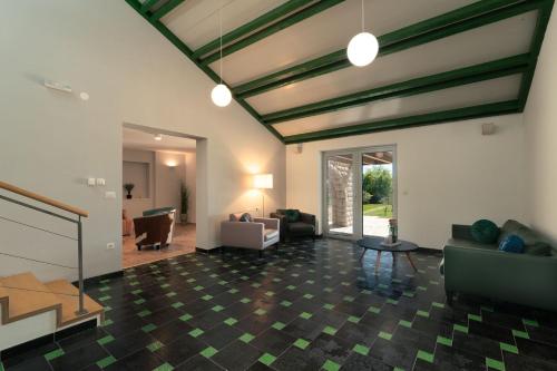 a large living room with couches and a table at Vila Agava, Konavle in Gruda