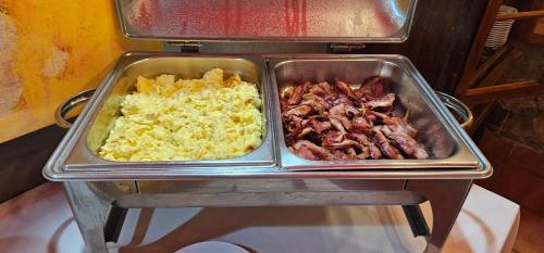 two trays of food sitting on top of a table at GH Bizkaia in Florianópolis