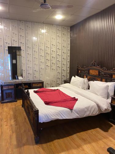Vuode tai vuoteita majoituspaikassa Legend Residency