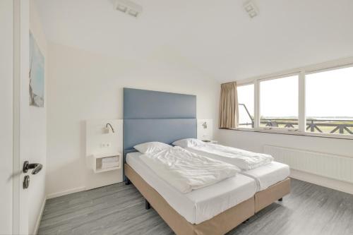 Postel nebo postele na pokoji v ubytování Appartement De Strandjutter - Residence Kabbelaarsbank (4 P) -not for companies