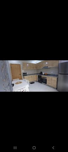 a kitchen with a stove and a counter top at Villa de luxe in Imouzzer Kandar