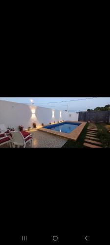 a picture of a swimming pool in a house at Villa de luxe in Imouzzer Kandar