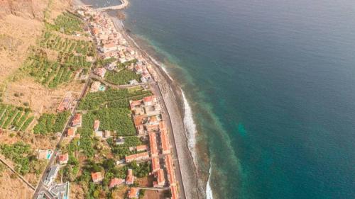 an aerial view of a beach and the ocean at Pauloldtown - Local experience w rooftop n jacuzzi in Paul do Mar