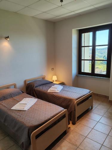Postel nebo postele na pokoji v ubytování Rifugio Escursionistico Valdivilla