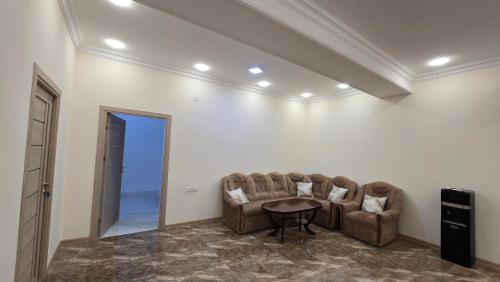 a living room with two chairs and a table at Alyona's house in Vagharshapat