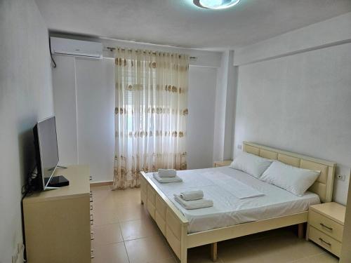 Postel nebo postele na pokoji v ubytování Gogo Apartment