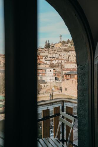 a view of a city from a window at El Niu de Martinet in Martinet