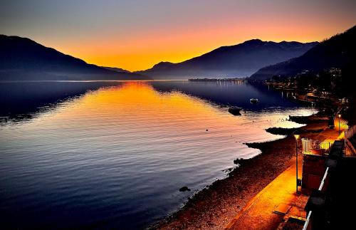 a view of a body of water at sunset at Casa Viola - Near the beach in Domaso