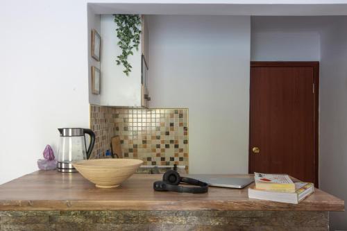 a kitchen counter with a bowl on top of it at Apartments MaXhit in Tivat