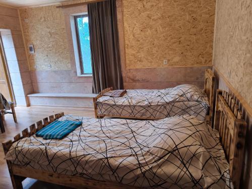 Postel nebo postele na pokoji v ubytování Berdavan Guesthouse