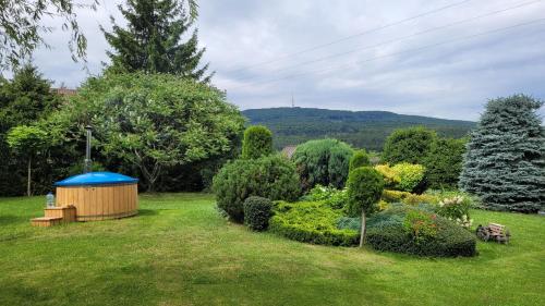 a gazebo in the middle of a garden at Sulidom in Sulistrowice
