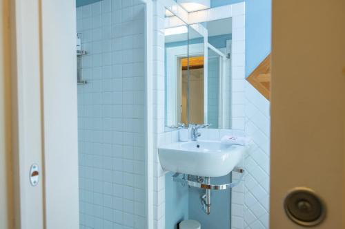a bathroom with a sink and a mirror at Romantic and Charming Apartments in Florence