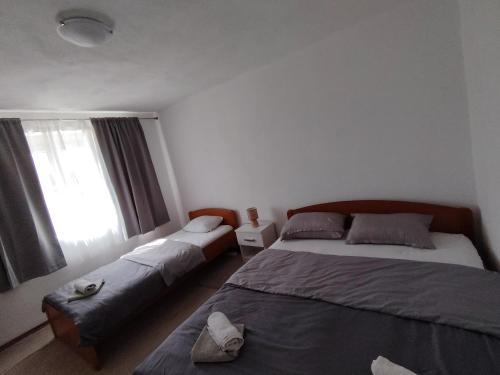 Postel nebo postele na pokoji v ubytování Apartman Vera