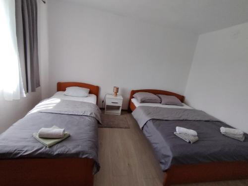 Postel nebo postele na pokoji v ubytování Apartman Vera