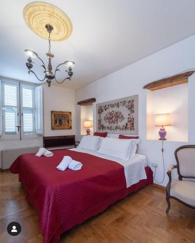 Postel nebo postele na pokoji v ubytování Corte Cristina & Suites